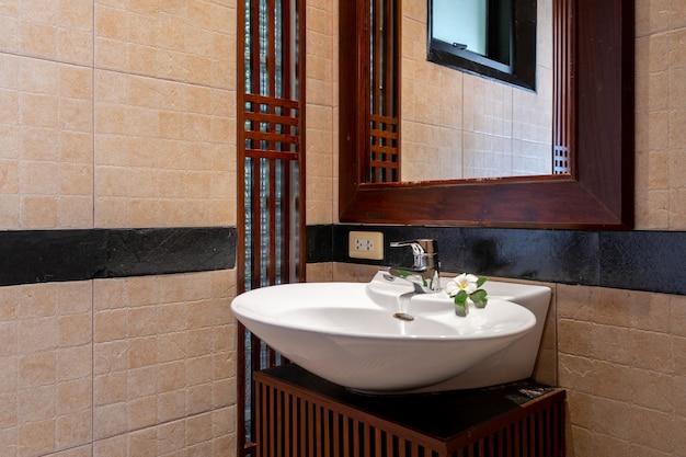 Toilet and sink in luxury pool villa