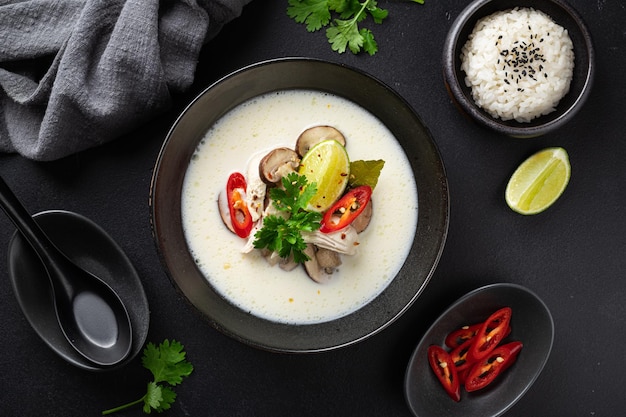 Tom kha gai on a black background flat lay