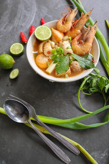 Tom yam soup originating from Thailand Tom yum is made with shrimp chili lime chicken fish or seafood and mushrooms