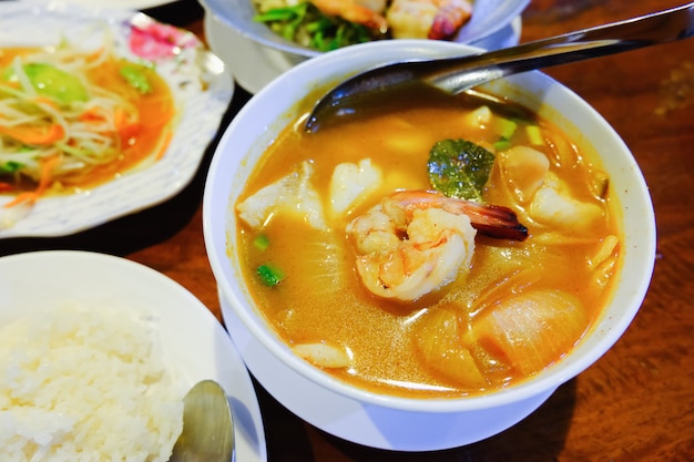 Tom Yum Goong on wood table, Thai Food