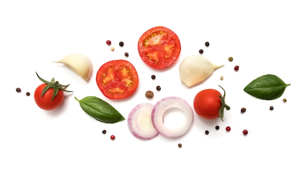 Photo tomato, garlic, basil, onions and spices isolate on a white background. vegan diet food, cooking concept, top view. food cooking background, food ingredients top view.