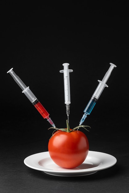 Tomato injected with three syringes