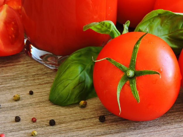 Tomato juice, tomatoes on a branch, basil, mix of peppers.