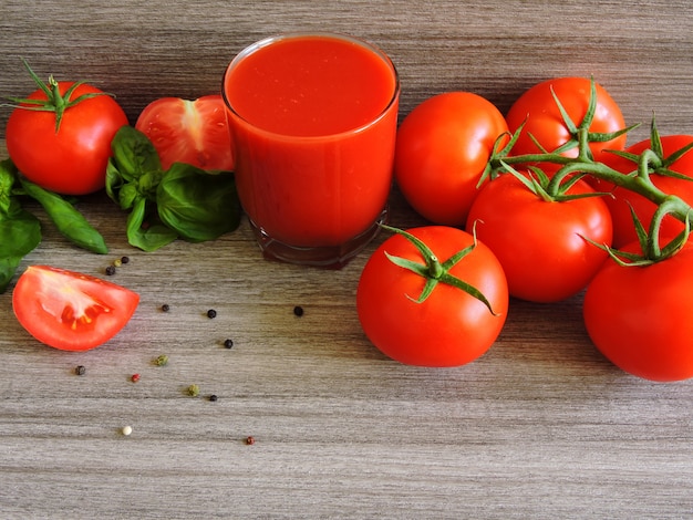 Tomato juice, tomatoes on a branch, basil, mix of peppers.  