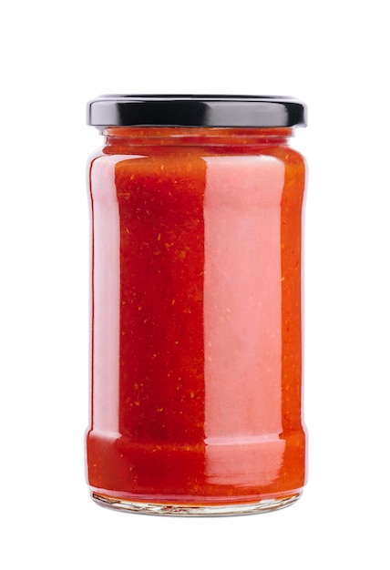 Tomato paste in a glass jar on a white background