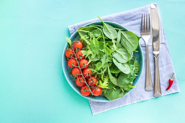 tomato salad cherry veggie green leaves fresh mix greens spinach arugula lettuce keto or paleo diet