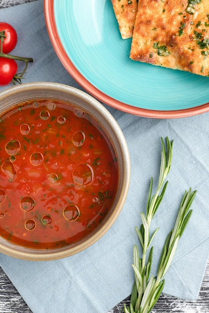 Tomato soup tomato soup on a white wooden background top view