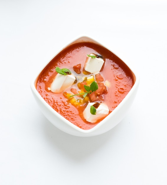 Tomato soup on a white surface