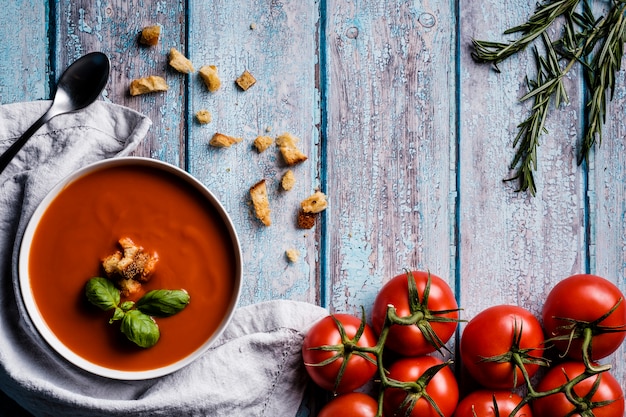 Tomato soup with basil in a bowl