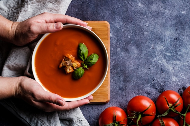 Tomato soup with basil in a bowl