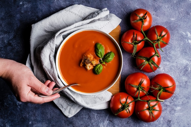 Tomato soup with basil in a bowl