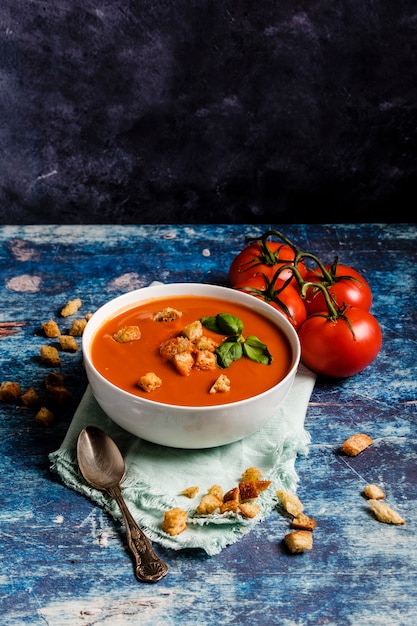 Tomato soup with basil in a bowl