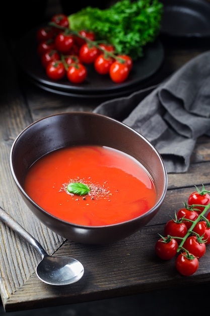 Tomato soup on wooden table