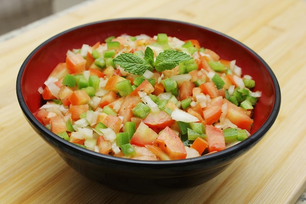 Tomato vinaigrette salad with mint and Bell pepper