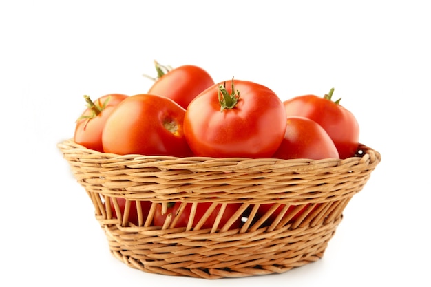 Tomatoes in basket isolated