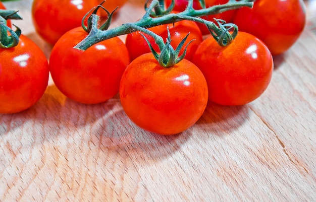 Tomatoes cherry on wood board