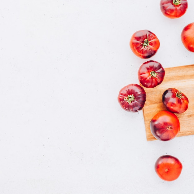 Tomatoes Mar Azul on white wooden table background