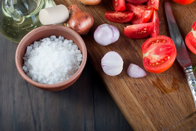 Tomatoes, onions, salt, ingredients for salad