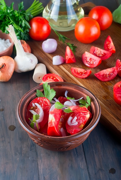 Tomatoes, onions, salt, ingredients for salad