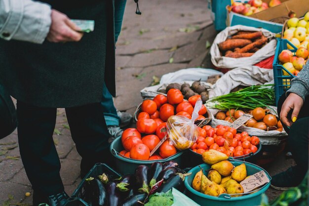 Tomatoes and other vegetables selling outdoor on the street Giving money Dirt Legal Pirate Fruit Place Centre Crime Farm Poor Raw Local Trade Price Open Food Red Sell City Health