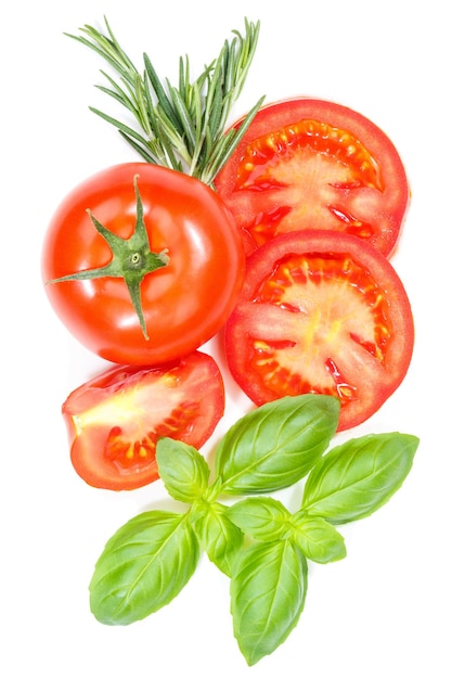 Tomatoes tomatos vegetables with basil from above portrait format isolated on white