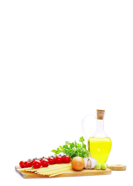 Tomatoes with green leaves isolated on white background