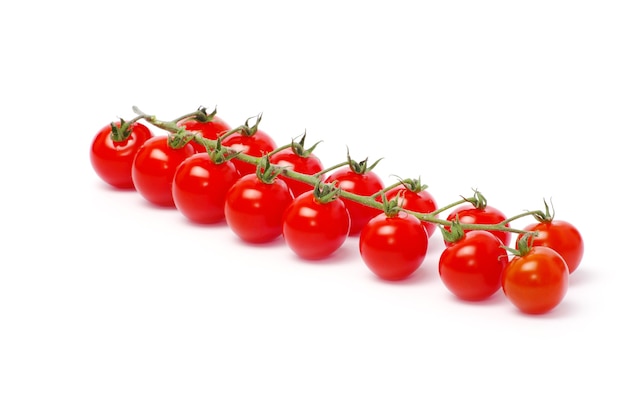 Tomatoes with green leaves isolated on white background