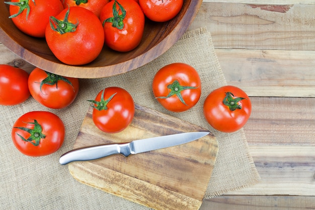 Tomatoes on wood background