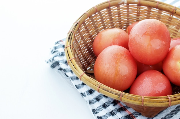 Tomatoes in a wooden basket.