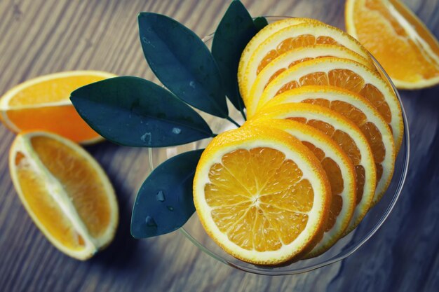 Toned orange fruit on wooden background