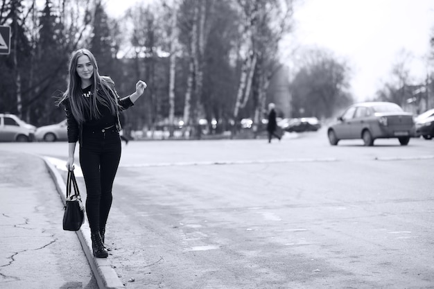 Toned picture of a young cute girl on a walk in the city