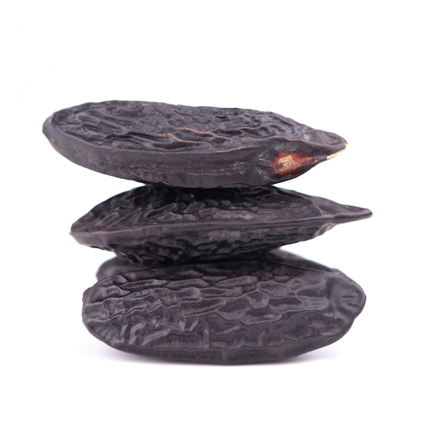 Tonka beans isolated. Bean of Dipteryx odorata, cumaru or kumaru. Fresh aroma tonka beans.