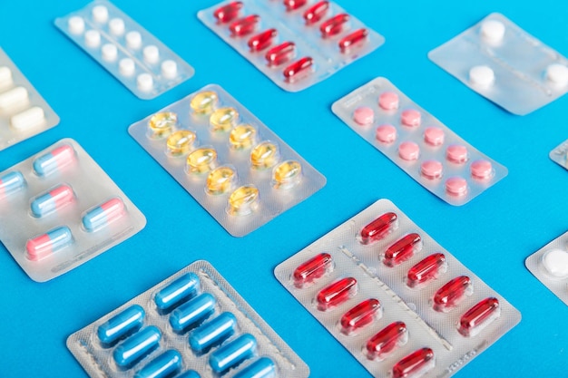 Too many different pill of various blisters with different pills Medicines storage at home concept Medication storing A pile of medicine in blister packs Pharmaceutical blister packs