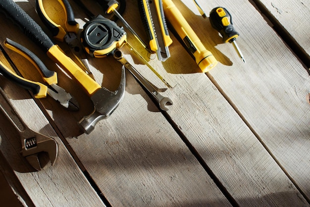 The tool kit is on the table from the wooden planks