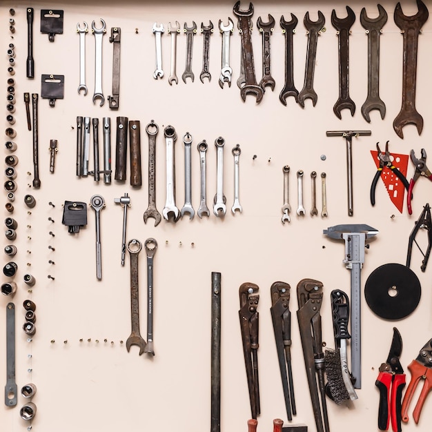 Tool storage and garage organization Organizers for garage tools Tools hanging on the wall in the workshop Tool shelf against the wall