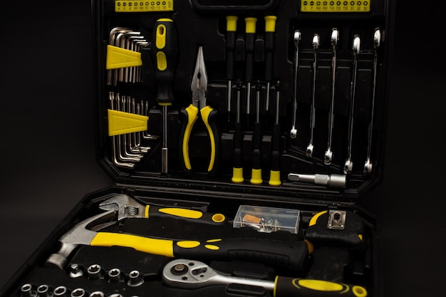 Toolbox various devices and sizes on black background detailed shot