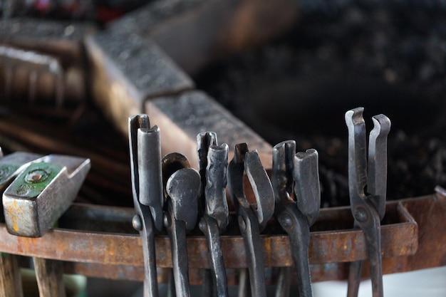 Tools of the blacksmith in blacksmith shop.