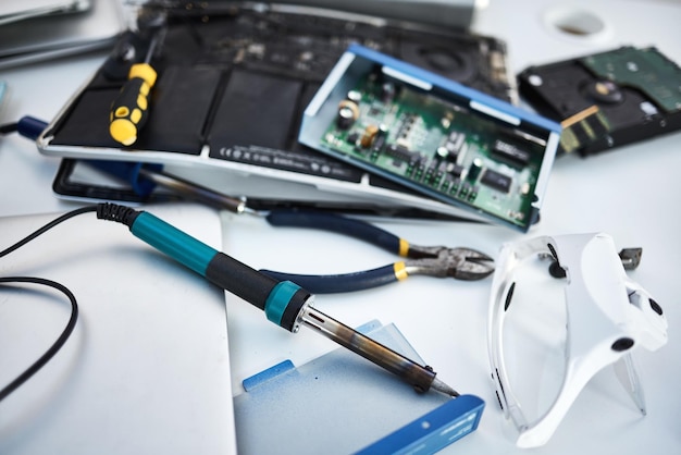 Tools computer hardware and equipment in the office for tech repairs maintenance or upgrade Database technology and supplies for electric board servers on a desk in the it industry workplace