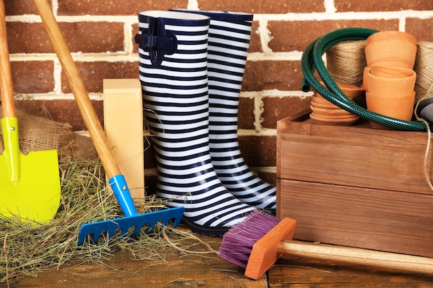 Tools of gardener on bricks background