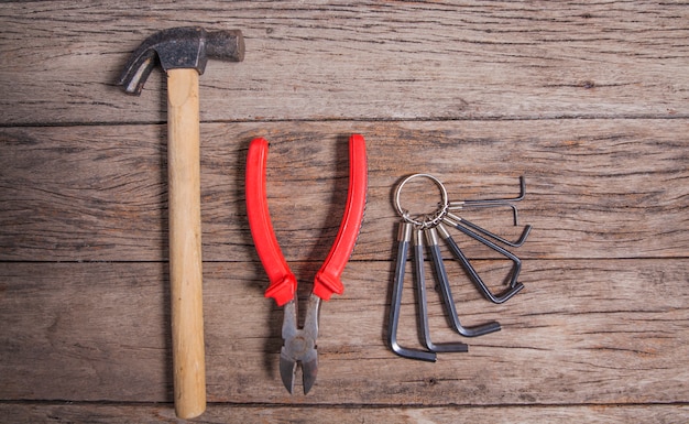 Tools hammer ,Cream, spanners  on wood table