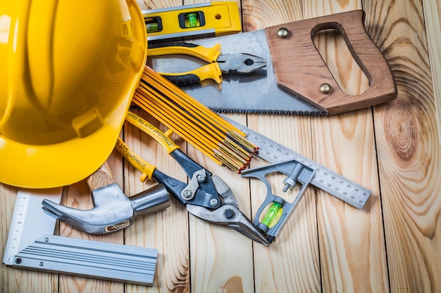 Tools and helmet on wooden boards