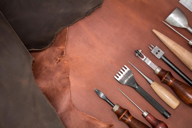 Tools for leather crafting and pieces of brown leather Manufacture of leather