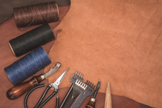 Tools for leather crafting and pieces of brown leather Manufacture of leather