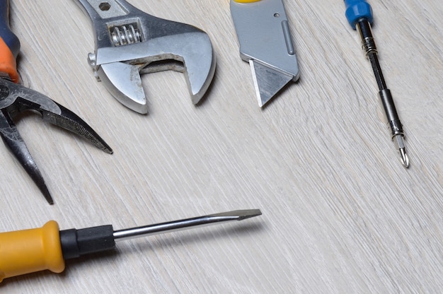 Photo tools for minor home repairs are on the countertop. view from above.