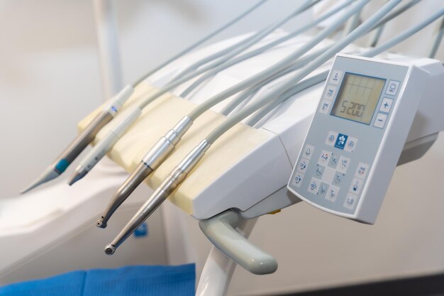 Tools used by doctors in a modern dental clinic next to the chair for operations