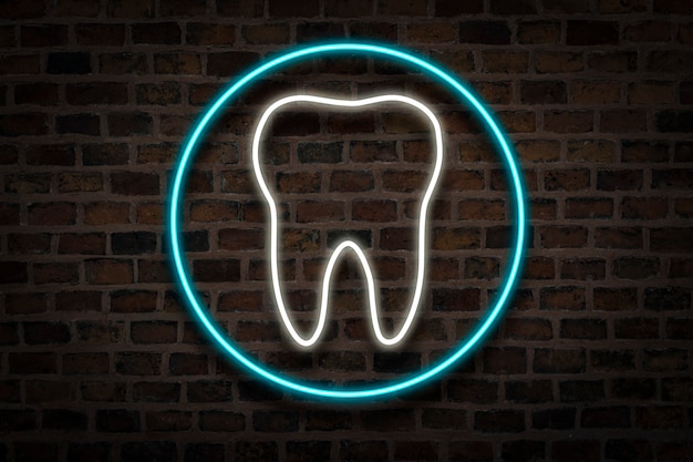 Tooth, neon sign on a brick wall. Dental clinic concept, first aid.