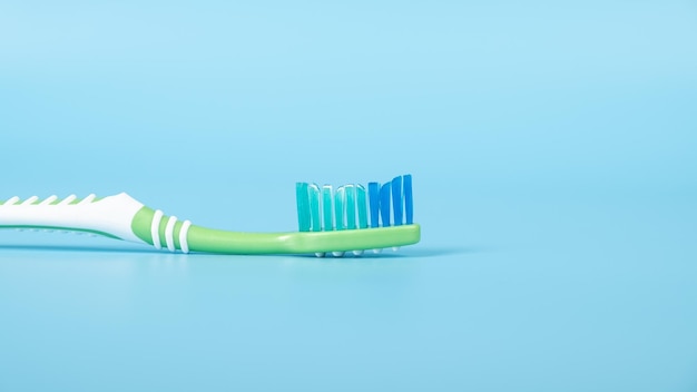 Toothbrush on a blue background closeup dental care