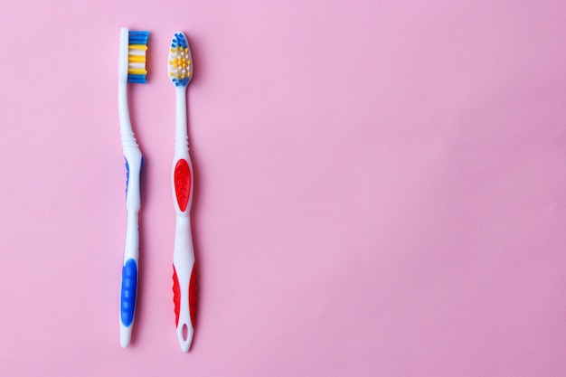 Toothbrushes on a colored background close up