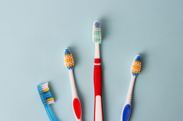 Toothbrushes on a colored background close up