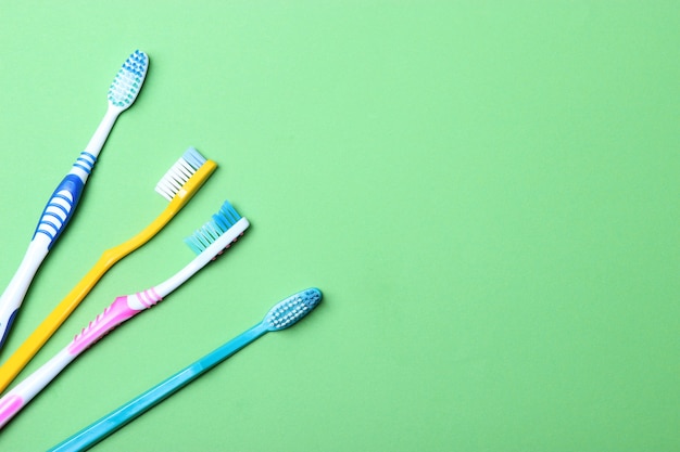 Toothbrushes on a colored background top view oral hygiene